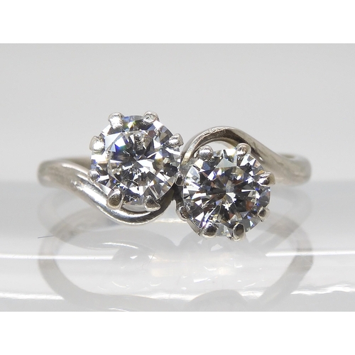 777 - AN 18CT & PLATINUM TWIN STONE DIAMOND RINGset with estimated approx 1.45cts of brilliant cut dia... 