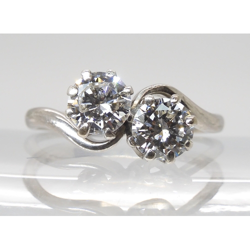 777 - AN 18CT & PLATINUM TWIN STONE DIAMOND RINGset with estimated approx 1.45cts of brilliant cut dia... 