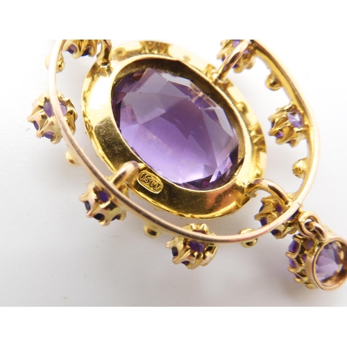 779 - A 15CT GOLD EDWARDIAN PENDANTset with amethyst and pearls, the central amethyst is approx 13.5mm x 1... 