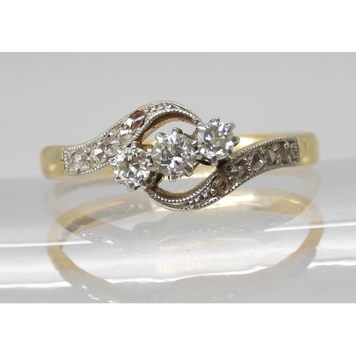 782 - A VINTAGE 18CT & PLATINUM THREE STONE DIAMOND RINGset with estimated approx 0.20cts of old cut a... 