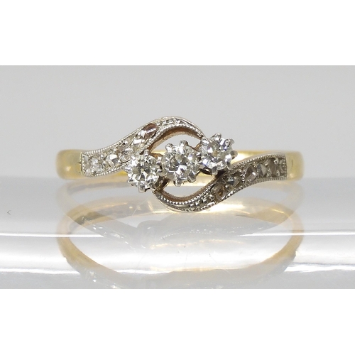 782 - A VINTAGE 18CT & PLATINUM THREE STONE DIAMOND RINGset with estimated approx 0.20cts of old cut a... 