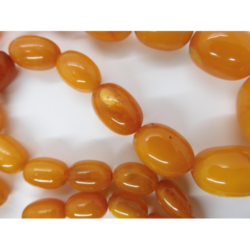 788 - A STRING OF AMBER COLOURED BEADSlargest bead 22.7mm, smallest 9.1mm, weight 33.4gms... 