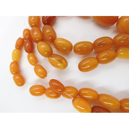 788 - A STRING OF AMBER COLOURED BEADSlargest bead 22.7mm, smallest 9.1mm, weight 33.4gms... 