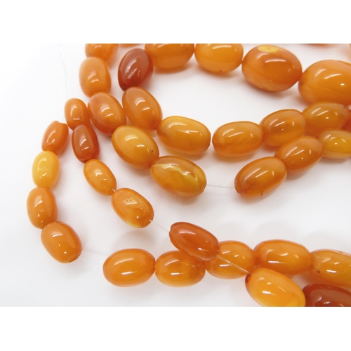 788 - A STRING OF AMBER COLOURED BEADSlargest bead 22.7mm, smallest 9.1mm, weight 33.4gms... 