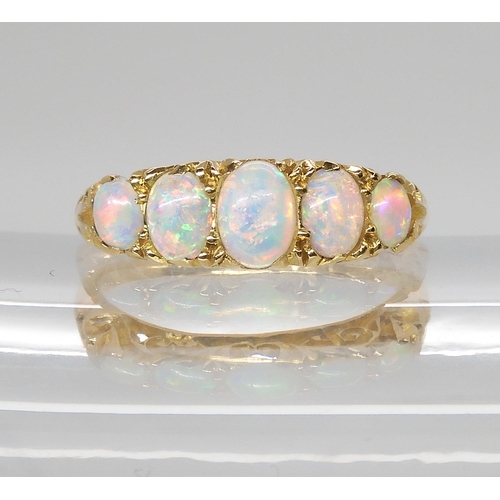 790 - AN 18CT GOLD FIVE STONE OPAL RINGthe opals are very lively with the full spectrum of colours, well m... 