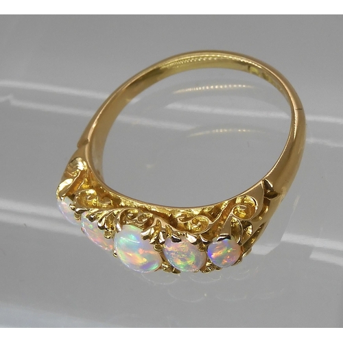 790 - AN 18CT GOLD FIVE STONE OPAL RINGthe opals are very lively with the full spectrum of colours, well m... 