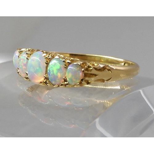 790 - AN 18CT GOLD FIVE STONE OPAL RINGthe opals are very lively with the full spectrum of colours, well m... 