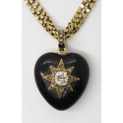 795 - A VICTORIAN MOURNING LOCKET AND CHAINset with an old cushion cut diamond of estimated approx 0.85cts... 