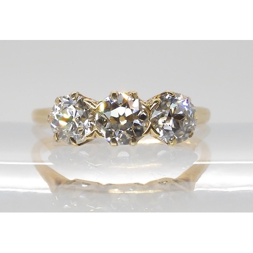 797 - A THREE STONE DIAMOND RINGset with estimated approx, 1.78cts of old cut diamonds in classic crown mo... 