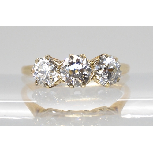 797 - A THREE STONE DIAMOND RINGset with estimated approx, 1.78cts of old cut diamonds in classic crown mo... 