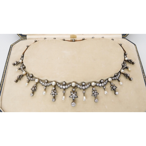 810 - A GARRARD & CO PEARL AND DIAMOND TIARAthe ultimate in metamorphic jewels, the tiara converts to ... 