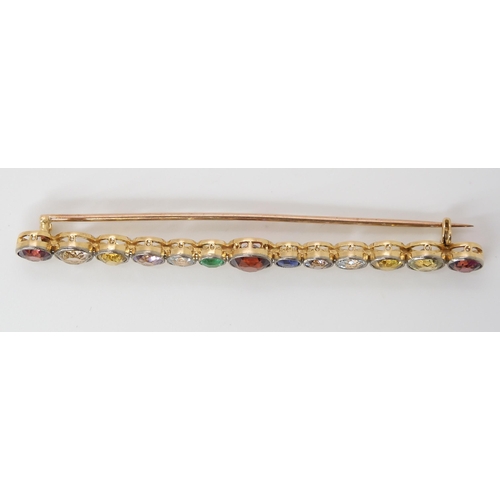 816 - A LARGE RAINBOW GEM SET BROOCH to include garnets, sapphire and emerald, set in yellow metal ga... 