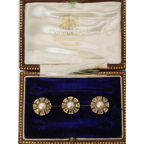 818 - A YELLOW METAL DIAMOND AND PEARL BROOCHin original box from Heming & Co, 28 Conduit St, London W... 