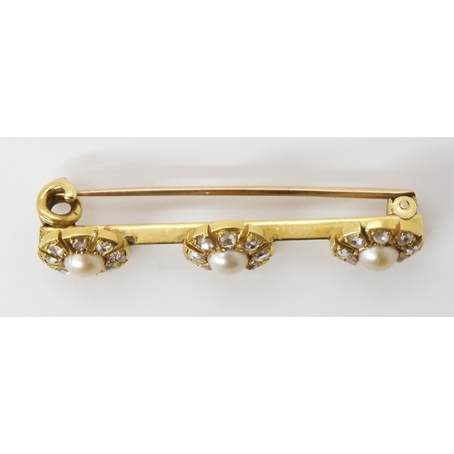 818 - A YELLOW METAL DIAMOND AND PEARL BROOCHin original box from Heming & Co, 28 Conduit St, London W... 