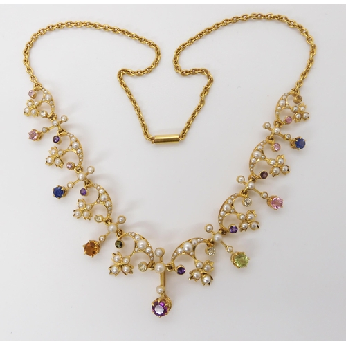 826 - A 15CT GOLD MULTI GEM AND PEARL SET NECKLACEset with amethysts, citrines, sapphires, tourmalines etc... 