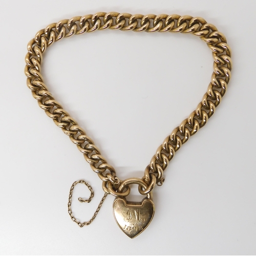 829 - A 9CT GOLD CURB LINK BRACELETwith a traditional heart shaped clasp, both chain and clasp stamped 9c,... 