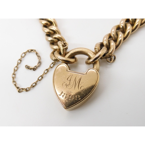 829 - A 9CT GOLD CURB LINK BRACELETwith a traditional heart shaped clasp, both chain and clasp stamped 9c,... 