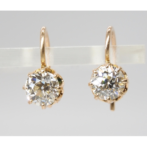 835 - A PAIR OF DIAMOND EARRINGSthe old cut diamonds weigh in at estimated approximately 1.50cts combined,... 