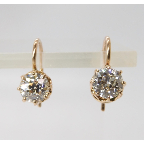 835 - A PAIR OF DIAMOND EARRINGSthe old cut diamonds weigh in at estimated approximately 1.50cts combined,... 