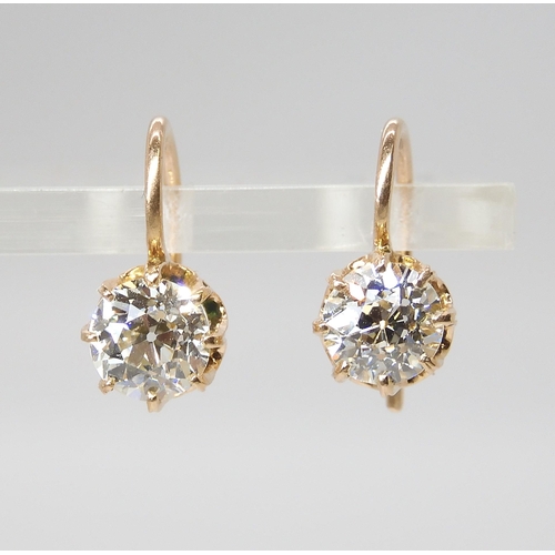 835 - A PAIR OF DIAMOND EARRINGSthe old cut diamonds weigh in at estimated approximately 1.50cts combined,... 