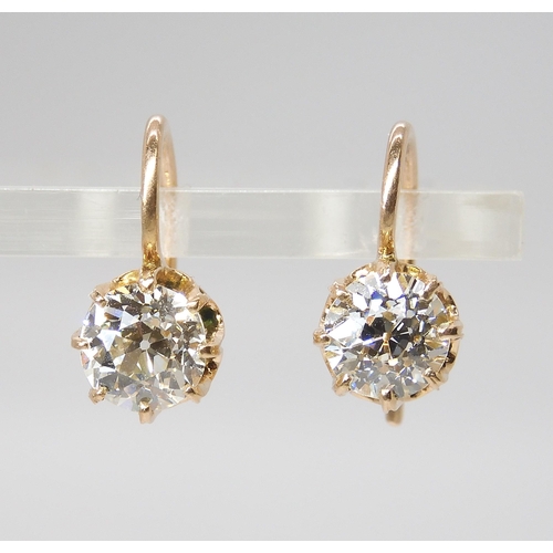 835 - A PAIR OF DIAMOND EARRINGSthe old cut diamonds weigh in at estimated approximately 1.50cts combined,... 