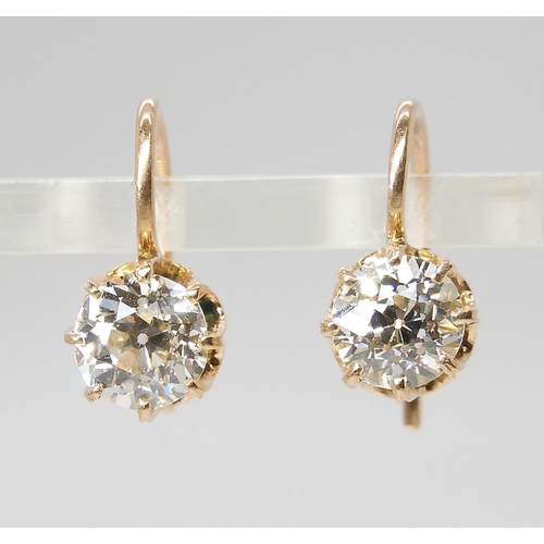 835 - A PAIR OF DIAMOND EARRINGSthe old cut diamonds weigh in at estimated approximately 1.50cts combined,... 