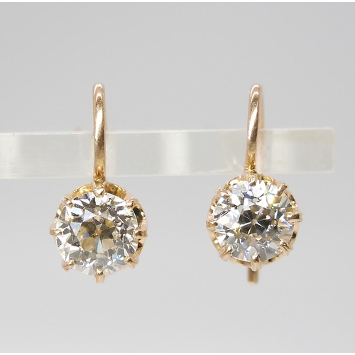 835 - A PAIR OF DIAMOND EARRINGSthe old cut diamonds weigh in at estimated approximately 1.50cts combined,... 