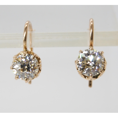 835 - A PAIR OF DIAMOND EARRINGSthe old cut diamonds weigh in at estimated approximately 1.50cts combined,... 