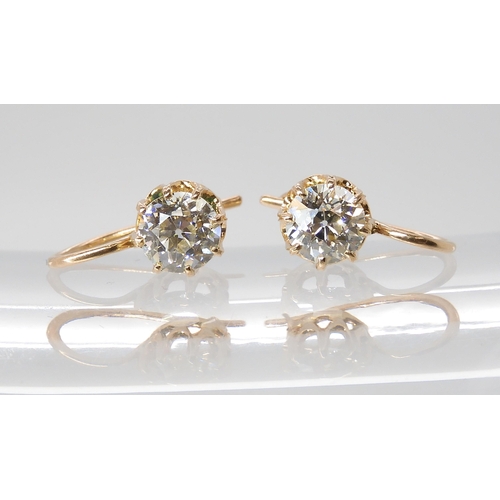 835 - A PAIR OF DIAMOND EARRINGSthe old cut diamonds weigh in at estimated approximately 1.50cts combined,... 