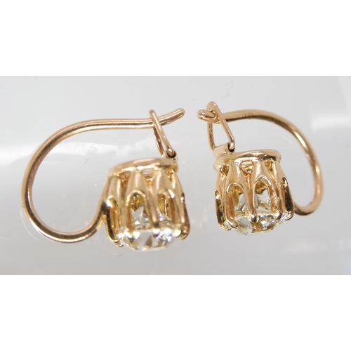 835 - A PAIR OF DIAMOND EARRINGSthe old cut diamonds weigh in at estimated approximately 1.50cts combined,... 