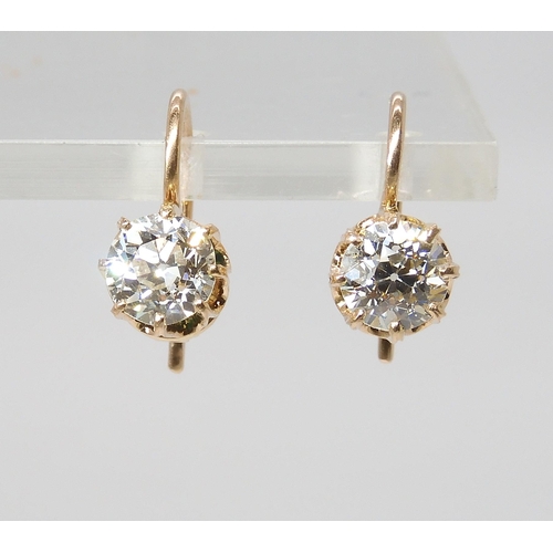 835 - A PAIR OF DIAMOND EARRINGSthe old cut diamonds weigh in at estimated approximately 1.50cts combined,... 