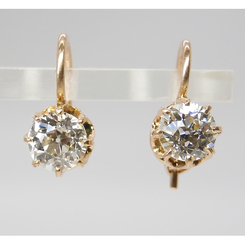 835 - A PAIR OF DIAMOND EARRINGSthe old cut diamonds weigh in at estimated approximately 1.50cts combined,... 