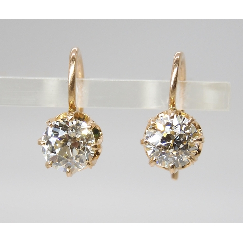 835 - A PAIR OF DIAMOND EARRINGSthe old cut diamonds weigh in at estimated approximately 1.50cts combined,... 