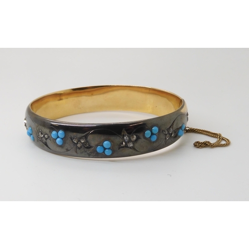 839 - A DIAMOND & TURQUOISE BANGLEthe area set with diamonds is dramatically blackened as a design fea... 