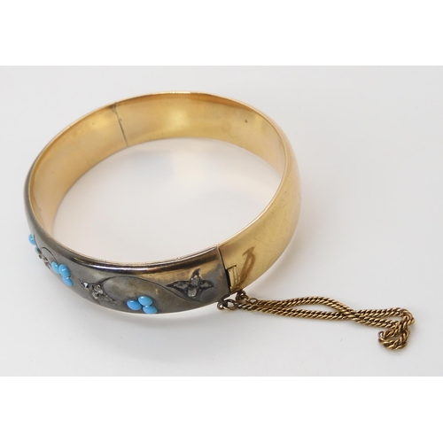 839 - A DIAMOND & TURQUOISE BANGLEthe area set with diamonds is dramatically blackened as a design fea... 