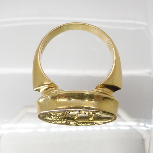 840 - AN 18CT GOLD SIGNET RINGintaglio cut with a family crest. hallmarked London 1987, Maker's mark WB, f... 