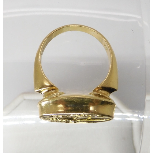 840 - AN 18CT GOLD SIGNET RINGintaglio cut with a family crest. hallmarked London 1987, Maker's mark WB, f... 