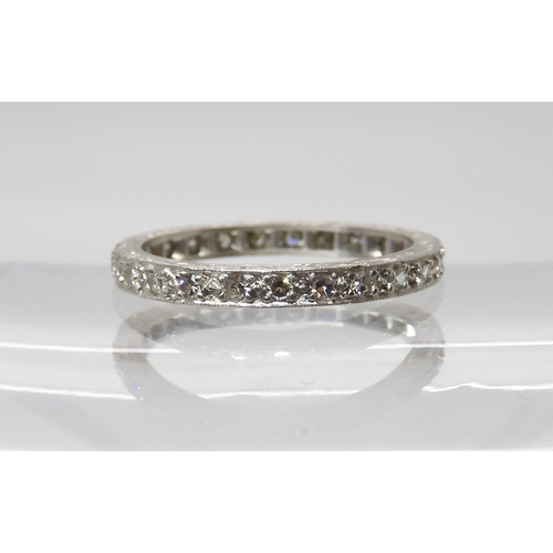 842 - A SLIM DIAMOND FULL ETERNITY RINGset with estimated approx 0.30cts of eight cut diamonds, made in un... 