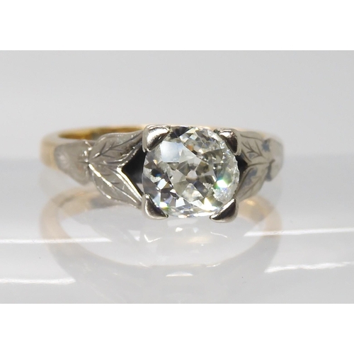 844 - AN 18CT OLD CUT DIAMOND RINGwith white gold leaf design shoulders the approximate dimensions of the ... 