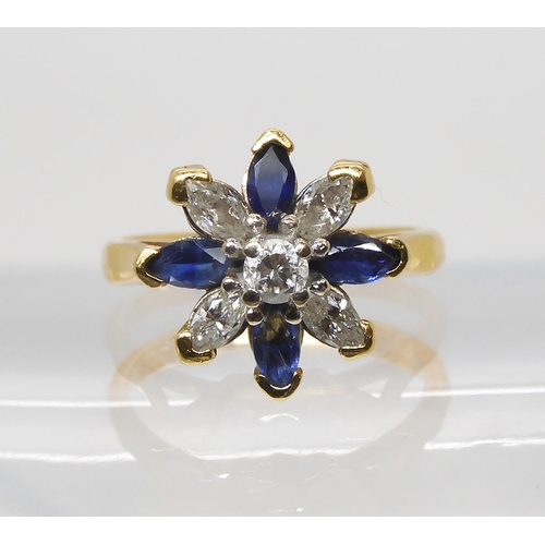 845 - A SAPPHIRE AND DIAMOND FLOWER RINGset with four marquis diamonds and a brilliant cut, with an estima... 