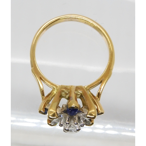 845 - A SAPPHIRE AND DIAMOND FLOWER RINGset with four marquis diamonds and a brilliant cut, with an estima... 