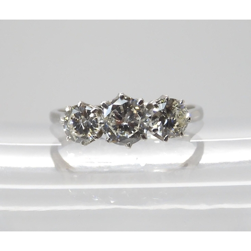 846 - A THREE STONE DIAMOND RINGset throughout in platinum. the three brilliant cut diamond are estimated ... 