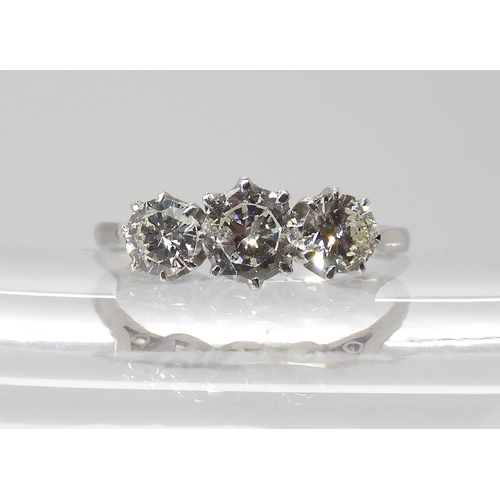 846 - A THREE STONE DIAMOND RINGset throughout in platinum. the three brilliant cut diamond are estimated ... 