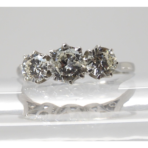 846 - A THREE STONE DIAMOND RINGset throughout in platinum. the three brilliant cut diamond are estimated ... 