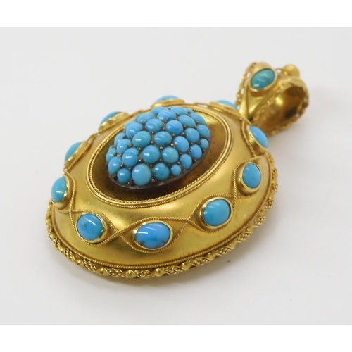 847 - A VICTORIAN TURQUOISE LOCKET BACK PENDANTmade in bright yellow metal with wire work detail. Length 5... 