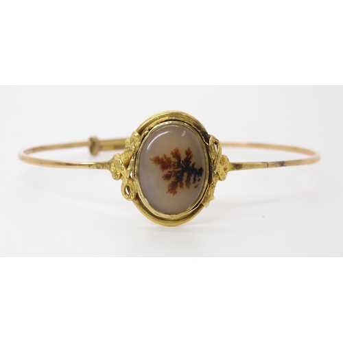 848 - A DENDRITIC AGATE SNAKE BANGLEthe setting of the agate has a coiled snake to each side. Made in unha... 