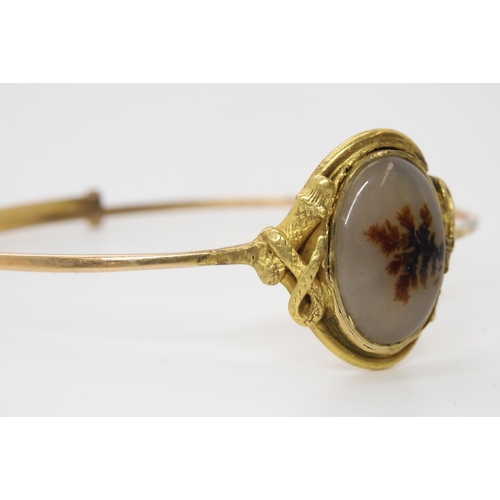 848 - A DENDRITIC AGATE SNAKE BANGLEthe setting of the agate has a coiled snake to each side. Made in unha... 