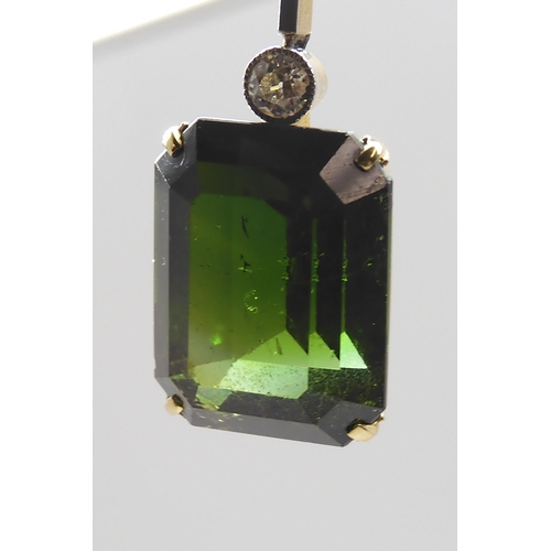 853 - A 15CT TOURMALINE AND DIAMOND PENDANTmounted in yellow and white metal, the emerald cut tourmaline m... 