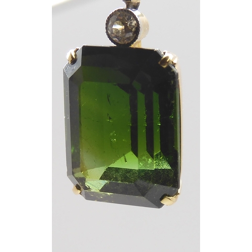 853 - A 15CT TOURMALINE AND DIAMOND PENDANTmounted in yellow and white metal, the emerald cut tourmaline m... 