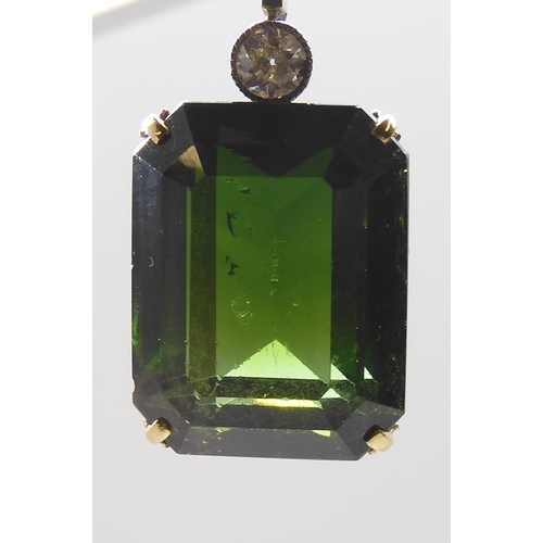 853 - A 15CT TOURMALINE AND DIAMOND PENDANTmounted in yellow and white metal, the emerald cut tourmaline m... 